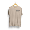 Beige t-shirt with 'BIG DOG COFFEE' text on a hanger against a white background